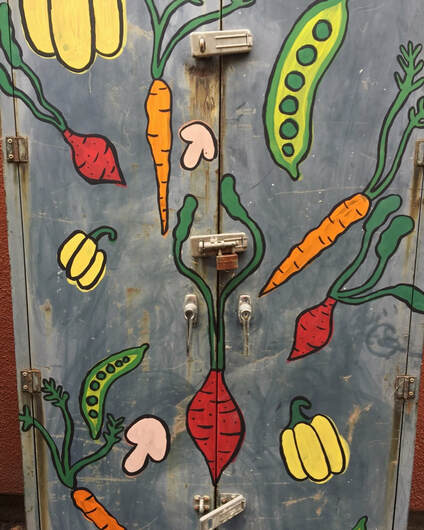 Picture of a cabinet painted with vegetables 