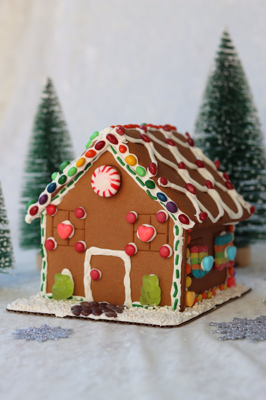 Gingerbread house with Christmas trees from virtual gingerbread decorating workshop for teams