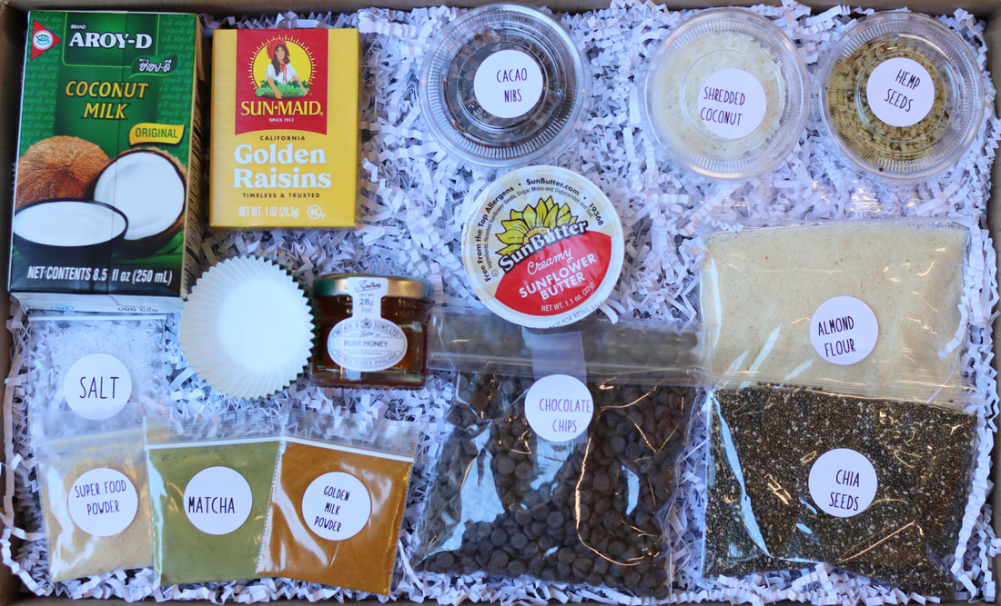 Healthy Dessert DIY Kit for team building activity shipped to each participant. Included in the package is hemp seeds, cacao nibs, nut butter, golden raisins, chia seeds, coconut milk, cacao nibs, honey, golden milk, matcha, superfood powder and chocolate chips.