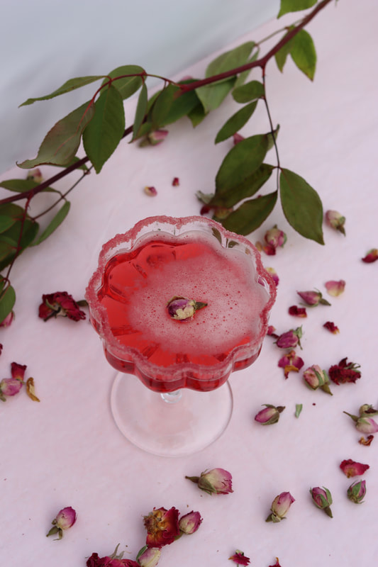 Valentine's day hibiscus margarita and chocolate rose truffled on plate