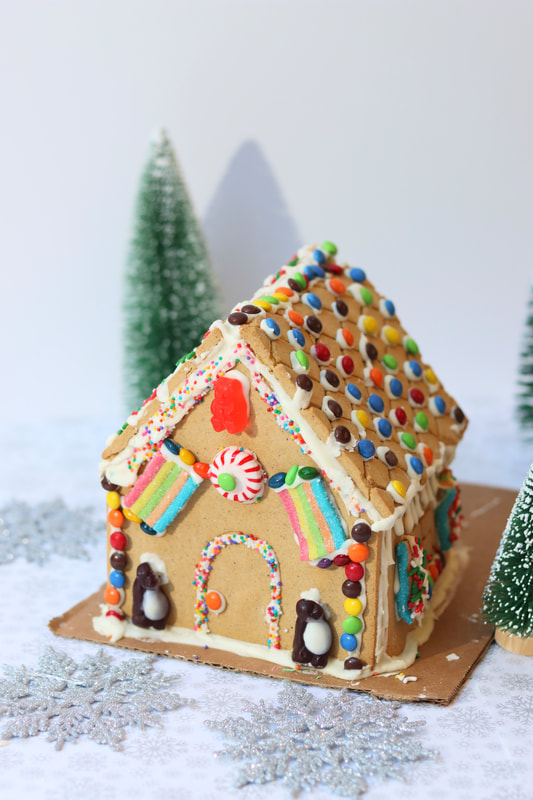 Gingerbread house with Christmas trees from virtual gingerbread decorating workshop for teams